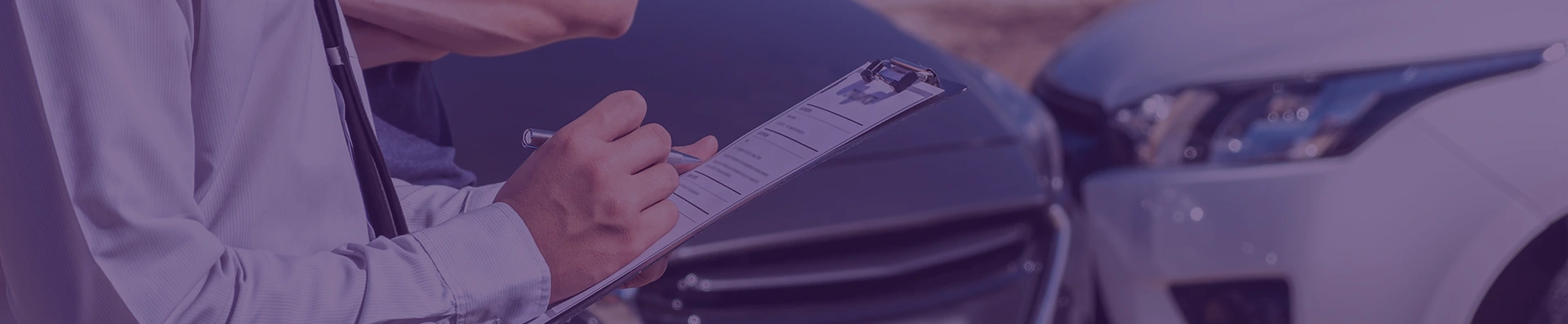 A person fills out a form indicating the damage to the cars involved in the accident